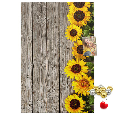 Cork notice board Sunflowers on a wooden board background