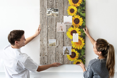 Cork notice board Sunflowers on a wooden board background