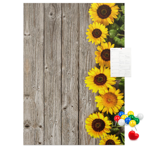 Cork notice board Sunflowers on a wooden board background