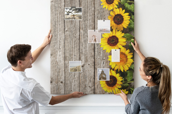 Cork notice board Sunflowers on a wooden board background