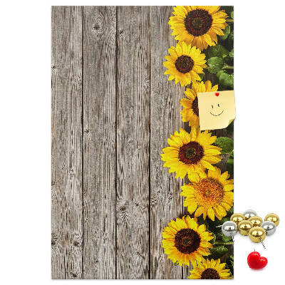 Cork notice board Sunflowers on a wooden board background