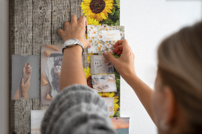 Cork notice board Sunflowers on a wooden board background