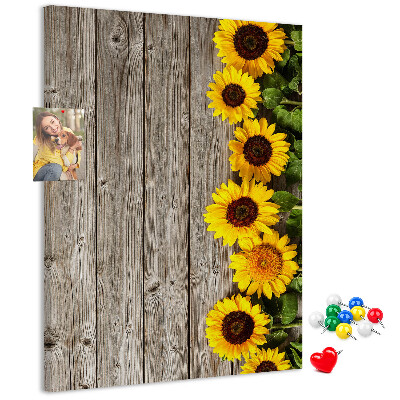 Cork notice board Sunflowers on a wooden board background