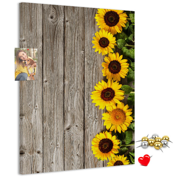 Cork notice board Sunflowers on a wooden board background
