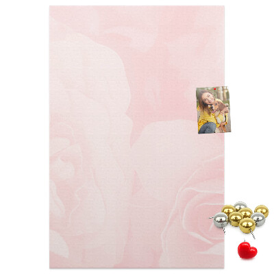 Wall cork memo board Delicate pink roses on the background.