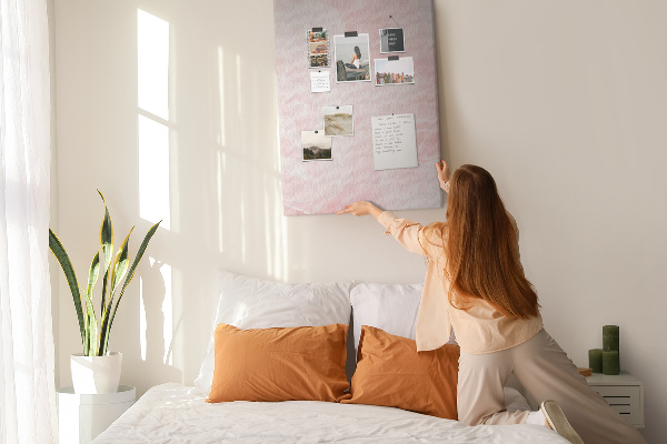Wall cork memo board Delicate pink roses on the background.