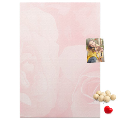 Wall cork memo board Delicate pink roses on the background.