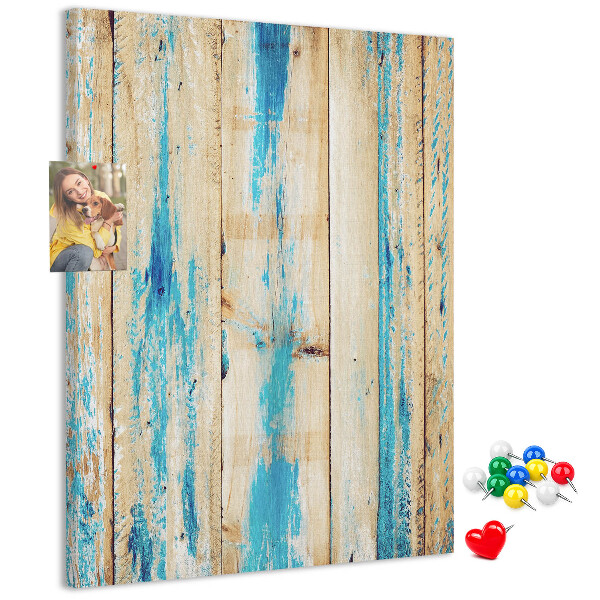 Cork notice board Old wooden panel with blue accents