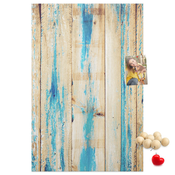 Cork notice board Old wooden panel with blue accents