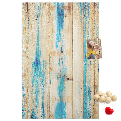Cork notice board Old wooden panel with blue accents