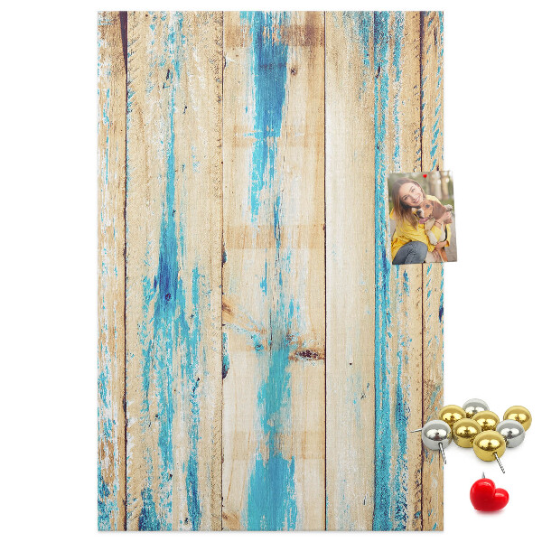 Cork notice board Old wooden panel with blue accents