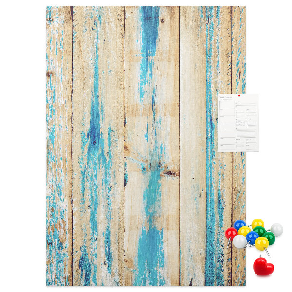 Cork notice board Old wooden panel with blue accents