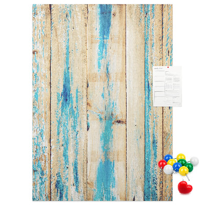 Cork notice board Old wooden panel with blue accents