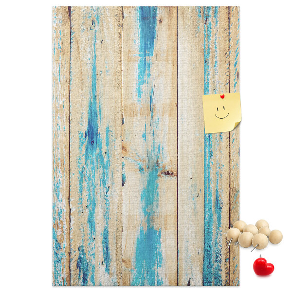Cork notice board Old wooden panel with blue accents