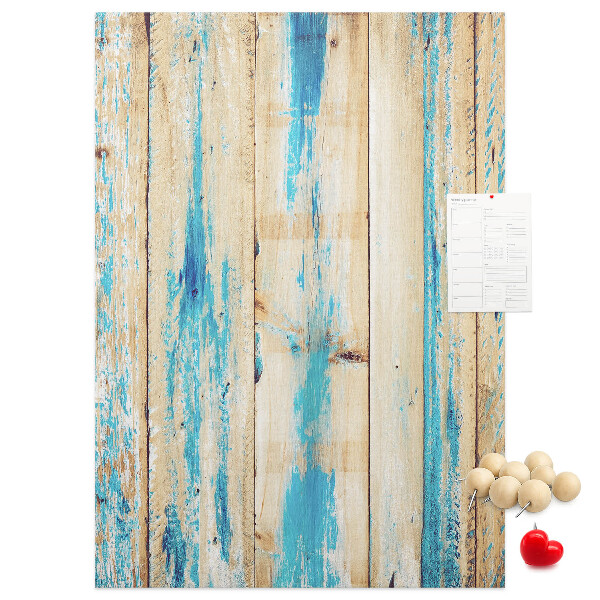 Cork notice board Old wooden panel with blue accents