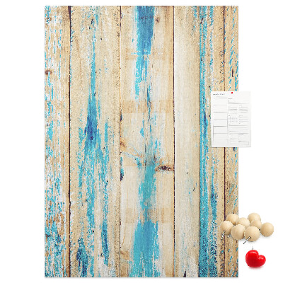 Cork notice board Old wooden panel with blue accents