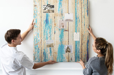Cork notice board Old wooden panel with blue accents