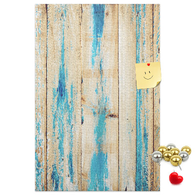 Cork notice board Old wooden panel with blue accents