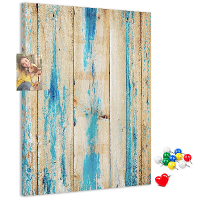 Cork notice board Old wooden panel with blue accents