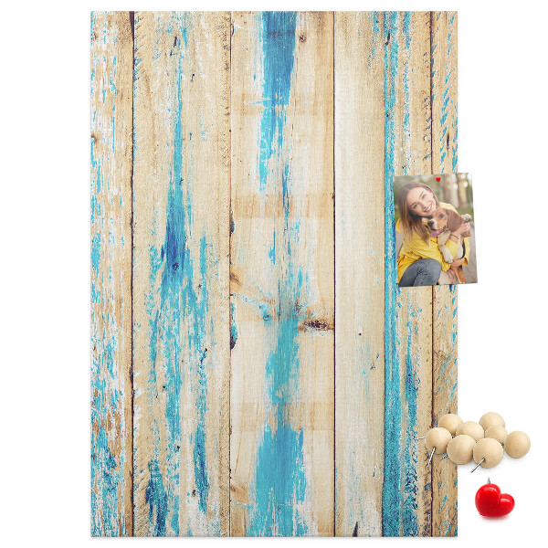 Cork notice board Old wooden panel with blue accents