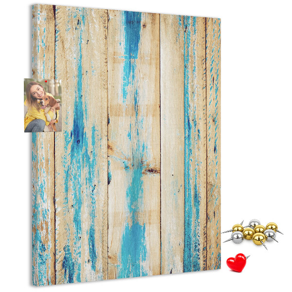 Cork notice board Old wooden panel with blue accents