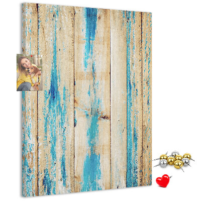 Cork notice board Old wooden panel with blue accents