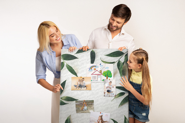 Wall cork memo board Green leaves on a light background