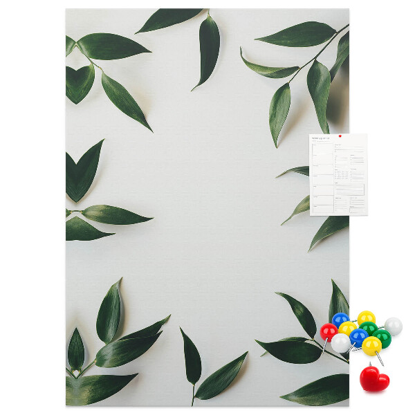 Wall cork memo board Green leaves on a light background