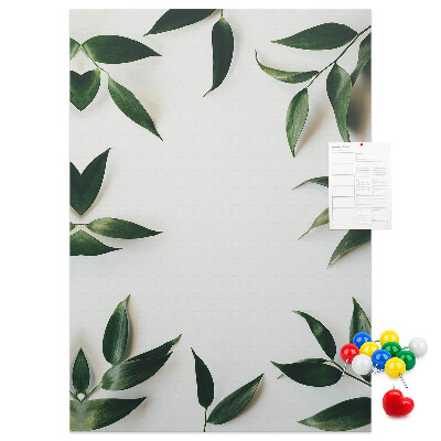Wall cork memo board Green leaves on a light background