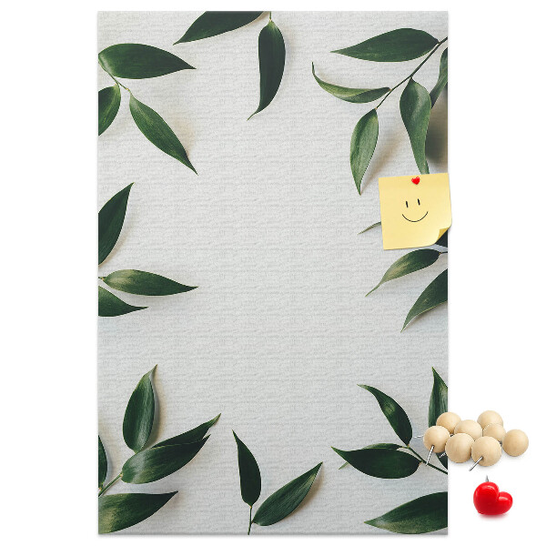 Wall cork memo board Green leaves on a light background