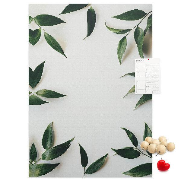 Wall cork memo board Green leaves on a light background