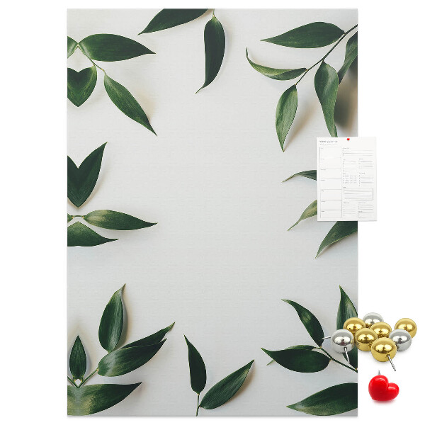 Wall cork memo board Green leaves on a light background
