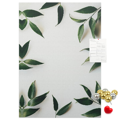 Wall cork memo board Green leaves on a light background