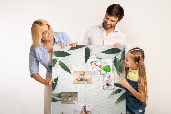 Wall cork memo board Green leaves on a light background