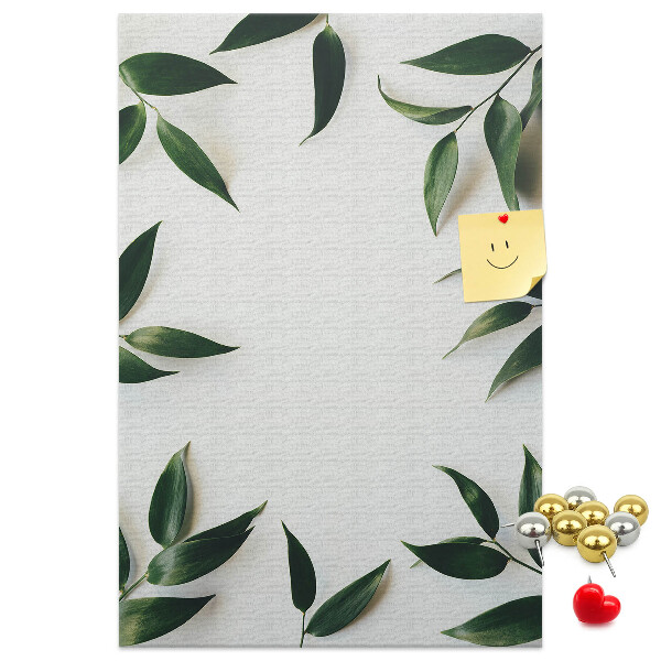 Wall cork memo board Green leaves on a light background