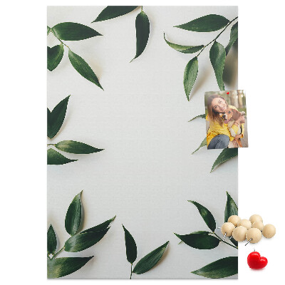 Wall cork memo board Green leaves on a light background
