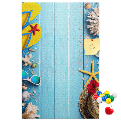 Wall cork memo board Summer accessories on a blue wood background