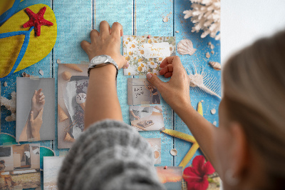 Wall cork memo board Summer accessories on a blue wood background