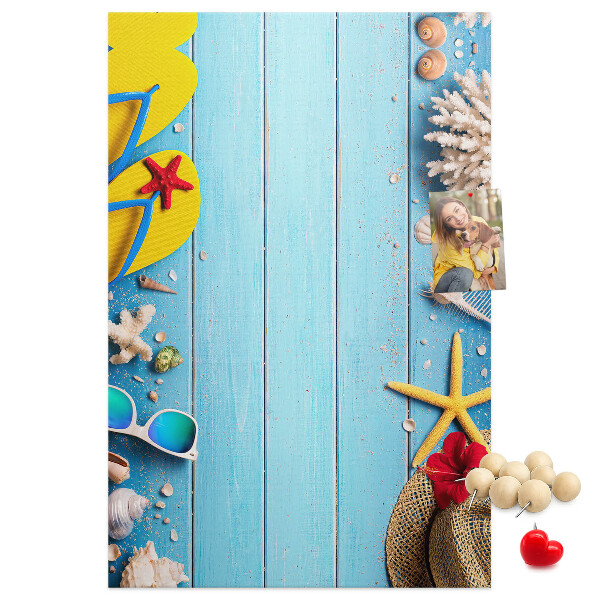Wall cork memo board Summer accessories on a blue wood background