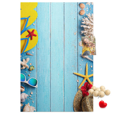 Wall cork memo board Summer accessories on a blue wood background