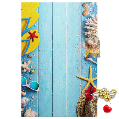 Wall cork memo board Summer accessories on a blue wood background