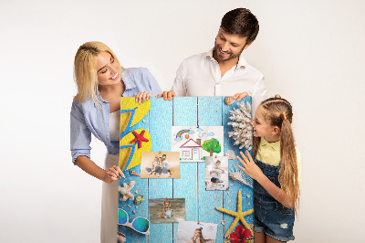 Wall cork memo board Summer accessories on a blue wood background