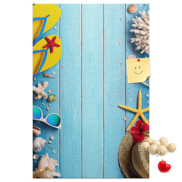 Wall cork memo board Summer accessories on a blue wood background