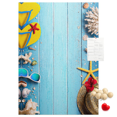 Wall cork memo board Summer accessories on a blue wood background