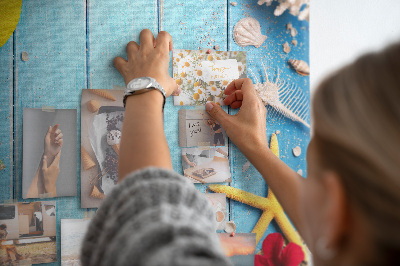 Wall cork memo board Summer accessories on a blue wood background