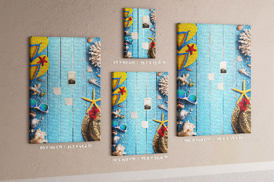 Wall cork memo board Summer accessories on a blue wood background