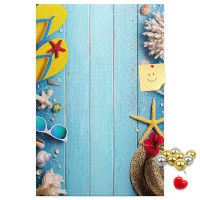 Wall cork memo board Summer accessories on a blue wood background