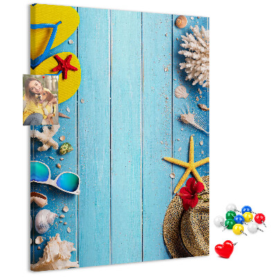 Wall cork memo board Summer accessories on a blue wood background
