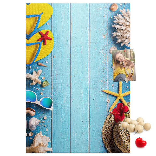 Wall cork memo board Summer accessories on a blue wood background