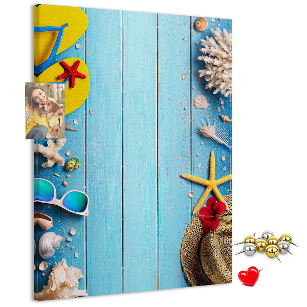 Wall cork memo board Summer accessories on a blue wood background